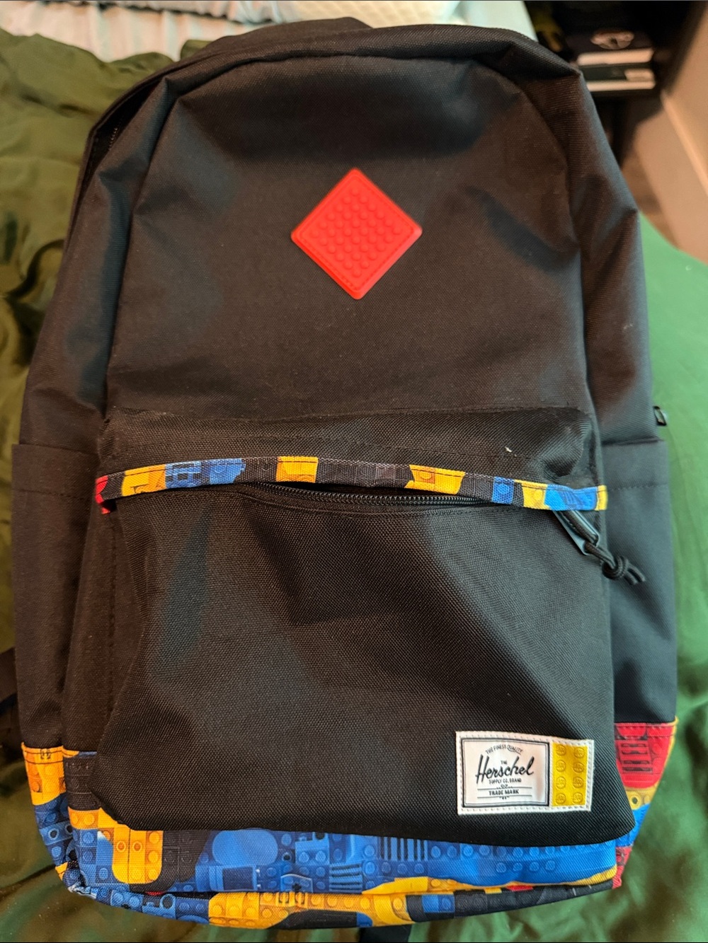 Herschel Supply Company Black Backpack with Red Patch and Blue-Yellow Trim LEGO